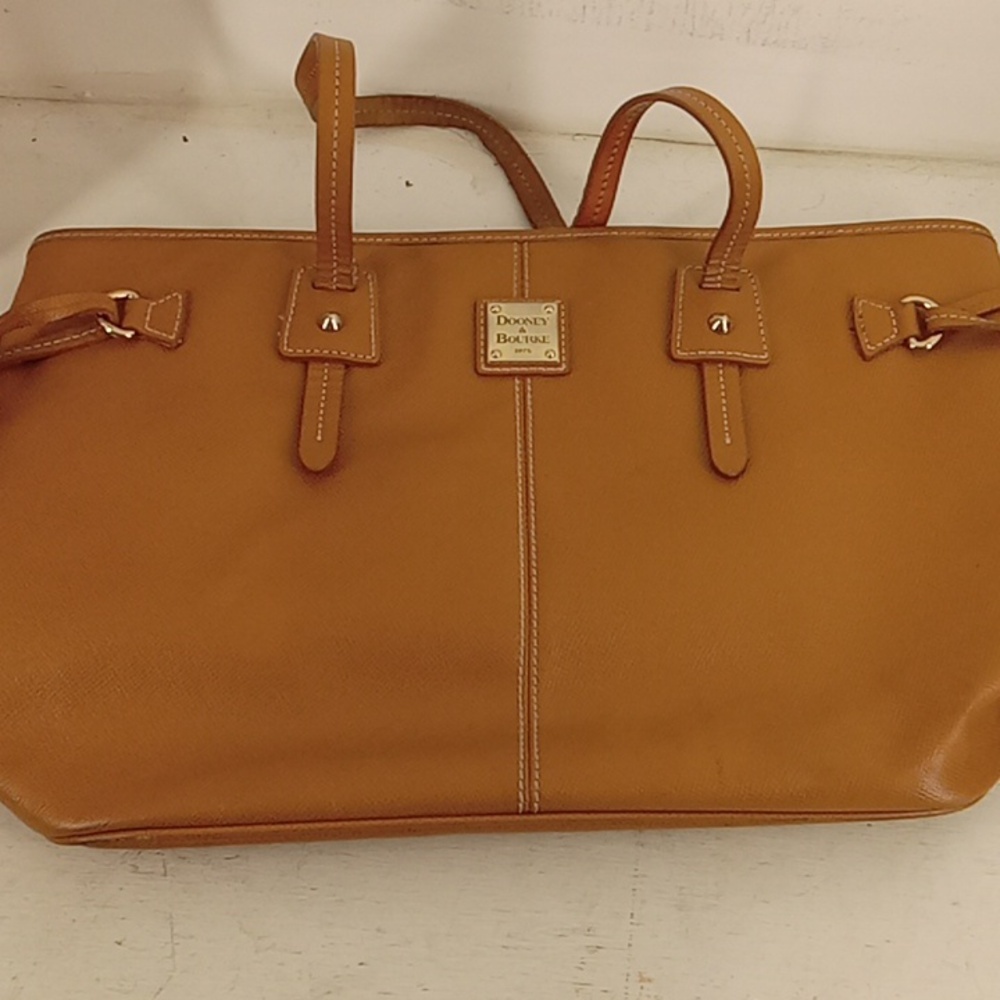Dooney & Bourke Hand bag One zipper pocket, 3 small pockets inside.Side